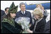 Mrs. Lynne Cheney is given a bouquet of flowers upon arrival to Astana, Kazakhstan, Friday, May 5, 2006. While in Kazakhstan Mrs. Cheney will meet with young Kazakh leaders to encourage people-to-people ties between the U.S. and Kazakhstan.