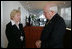 Vice President Dick Cheney meets with Inna Kuley, wife of recently jailed Belarusian democracy advocate Alyaksandr Milinkevich, at the Vilnius Conference 2006 in Vilnius, Lithuania, Thursday, May 4, 2006. Earlier in the day the Vice President delivered the conference's keynote speech and called for the release of Milinkevich and other activists who were jailed after pledging to use civil disobedience to bring about the removal of Belarusian President Alyaksandr Lukashenka. 