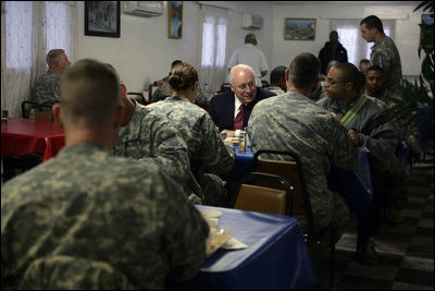 Vice President Dick Cheney has breakfast with members of the U.S. military, Feb. 27, 2007, at Bagram Air Base in Afghanistan. Due to bad weather the Vice President postponed travel to Kabul and spent the previous night at Bagram, making him the highest-ranking U.S. official to stay overnight in Afghanistan. White House photo by David Bohrer