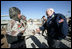 Vice President Dick Cheney visits the 9th Mechanized Infantry Division Headquarters at Taji Air Base to greet Iraqi troops and view tanks and armored vehicles they have refurbished into working fighting vehicles, Sunday Dec. 18, 2005.