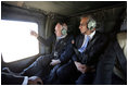 Vice President Dick Cheney and Zalmay Khalilzad, Ambassador to Iraq, depart from Taji Air Base at the 9th Infantry Division Headquarters via helicopter, Sunday Dec. 18, 2005.