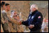 Vice President Dick Cheney attends a rally with US troops at Al-Asad Airbase in Iraq, Dec. 18, 2005.