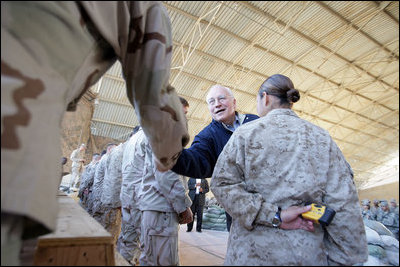 Vice President Dick Cheney attends a rally with US troops at Al-Asad Airbase in Iraq, Dec. 18, 2005.