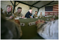 Vice President Dick Cheney holds a group discussion at AL-Asad Airbase in Iraq, Sunday Dec. 18, 2005.