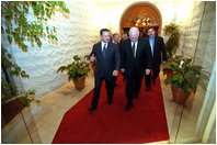 After attending a working dinner at the Al-Baraka Palace, Vice President Dick Cheney departs with King Abdullah II of Jordan March 12.