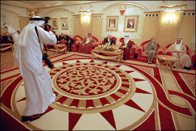 As an official photographer records the moment, Vice President Dick Cheney and King Hamad of Bahrain meet in Manama, Bahrain, March 17. "My role in part has been to travel around the region and let all of our friends in the region know the importance of our commitment to try to resolve this conflict," said the Vice President later during a press conference with Crown Prince Salman of Bahrain at Shaikh Hamad Palace.