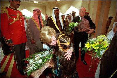 Two children greet Vice Present Dick Cheney and Mrs. Cheney with bouquets of flowers upon their arrival at Dasman Palace in Kuwait City, Kuwait, March 18.