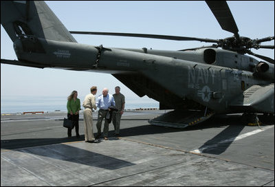 USS John C. Stennis Strike Group Commander Rear Admiral Kevin Quinn greets Vice President Dick Cheney and his daughter Liz Cheney, left, upon their arrival, Friday, May 11, 2007, to the aircraft carrier John C. Stennis in the Persian Gulf.