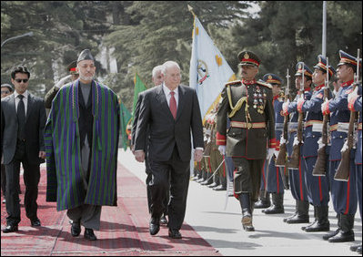 Vice President Dick Cheney, accompanied by President Hamid Karzai of Afghanistan, reviews an honor guard upon his arrival to Kabul Thursday, March 20, 2008. The Vice President's visit to Afghanistan is the third stop on a 10-day trip to the Middle East and Turkey. 