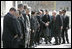 Vice President Dick Cheney is escorted by President of Afghanistan Hamid Karzai as he greets Afghan officials upon arrival to Gul Khana Palace in Kabul Thursday, March 20, 2008. The Vice President met with President Karzai and Afghan officials to reaffirm America's commitment to Afghanistan and discuss ways the U.S. would continue to help Afghanistan become a more prosperous and stable nation. 