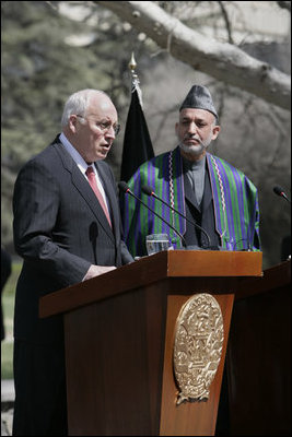 With President Hamid Karzai of Afghanistan looking on, Vice President Dick Cheney delivers a statement to the press Thursday, March 20, 2008 on the grounds of Gul Khana Palace in Kabul. "During the last six years, the people of Afghanistan have made a bold and confident journey, throwing off the burden of tyranny, winning your freedom and reclaiming your future," said the Vice President, adding, "The United States of America has proudly walked with you on this journey, and we walk with you still." 