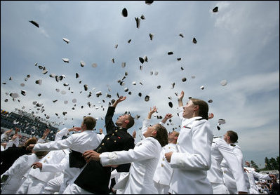 Graduates celebrate by throwing their caps into the air at the conclusion of the Graduation and Commissioning Ceremony for the U.S. Naval Academy Class of 2006, Friday, May 26, 2006 in Annapolis, Maryland.