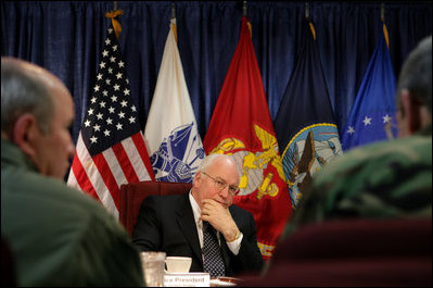 Vice President Dick Cheney is briefed at the USTRANSCOM Operations Command Center during a visit to Scott Air Base, Tuesday, March 21, 2006. During an average week USTRANSCOM coordinates and conducts more than 1,900 air missions and 10,000 ground shipments in 75 percent of the world's countries through both military and commercial resources..