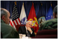 Vice President Dick Cheney is briefed at the USTRANSCOM Operations Command Center during a visit to Scott Air Base, Tuesday, March 21, 2006. During an average week USTRANSCOM coordinates and conducts more than 1,900 air missions and 10,000 ground shipments in 75 percent of the world's countries through both military and commercial resources..