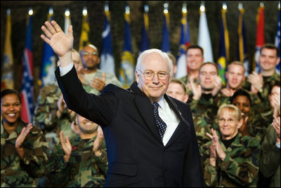 Vice President Dick Cheney waves in response to a warm welcome given by the troops and their families at a rally at Scott Air Base in Illinois, Tuesday, March 21, 2006.
