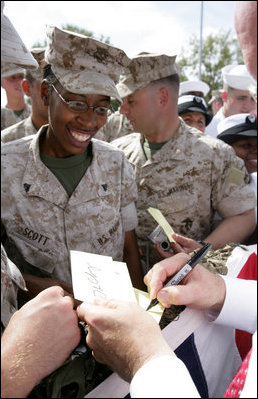 Vice President Dick Cheney shakes hands and signs autographs with U.S. Marines during a rally at Camp Lejeune in Jacksonville, NC, Monday October 3, 2005.