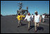 Vice President Dick Cheney walks the deck of the USS Stennis Aircraft Carrier, deployed in the Indian Ocean, March 15, 2002.