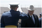 Vice President Dick Cheney is saluted before shaking hands with one of the 906 newly commissioned officers of the U.S. Air Force during the graduation ceremony at the Air Force Academy in Colorado on Wednesday, June 1, 2005.