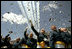Graduates toss their hats into the air as the contrails from five F-16's stream overhead during the U.S. Air Force Academy graduation in Colorado on Wednesday, June 1, 2005. Nine hundred and six graduates became commissioned officers in the U.S. Air Force after their four-year curriculum that began shortly before September 11, 2001.