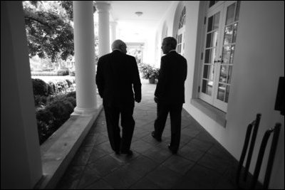 Vice President Dick Cheney walks with President George W. Bush through the West Wing colonnade to the Oval Office, June 8, 2006.