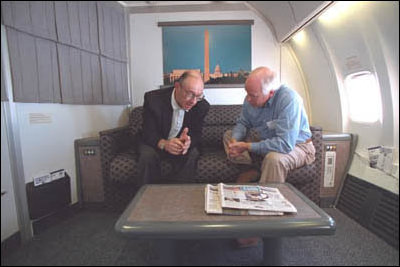 Aboard Air Force Two, Vice President Cheney and Chairman of the Federal Reserve Board Alan Greenspan talk. 