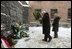 Vice President Dick Cheney, flanked by his daughter Liz Cheney, places a bouquet of flowers at the Wall of Death at the Auschwitz-1 Nazi concentration camp, near Krakow, Poland, Friday, Jan. 28, 2005. Vice President Cheney was there to take part in ceremonies commemorating the 60th Anniversary of the liberation of the Auschwitz camps. The Wall of Death was named for its use as the backdrop for firing squads where thousands of prisoners were executed while the camp was in operation.