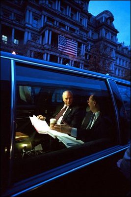 Vice President Dick Cheney holds a pre-dawn briefing in his car outside the Dwight D. Eisenhower Executive Office Building Jan 23, 2002.