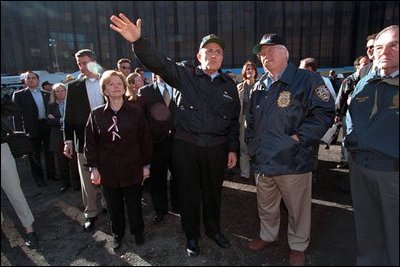 Guided by then-Mayor Rudolph Giuliani (center), Vice President Dick Cheney and Lynne Cheney tour ground zero and talk with rescue workers in New York City Oct. 18, 2001. "The people of New York have seen appalling tragedy and suffering. This afternoon I was at ground zero and I saw the damage at close range. It is staggering; almost beyond a person's ability to describe," the Vice President said at the 56th Annual Alfred E. Smith Memorial Foundation Dinner. 