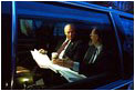  Vice President Dick Cheney holds a pre-dawn briefing in his car outside the Dwight D. Eisenhower Executive Office Building Jan 23, 2002.