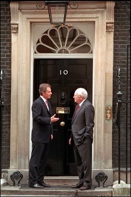 Standing in front of Prime Minister Tony Blair's residence, Number 10 Downing Street, Vice President Dick Cheney shares some final words before departing London March 11, 2002. 