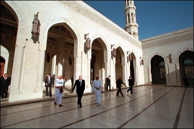 During his visit to Muscat, Oman, Vice President Dick Cheney passes under pointed arches and ornate engravings during a tour of the country's massive Grand Mosque, which spans an area of about 25 square miles, March 16, 2002.