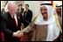 Vice President Dick Cheney jokes with First Deputy Prime Minister Sabah prior to departure from Kuwait City, Kuwait, March 18, 2002.