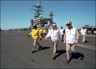 Talking with pilots on mission in Afghanistan, Vice President Dick Cheney tours the USS Stennis Aircraft Carrier March 15, 2002.