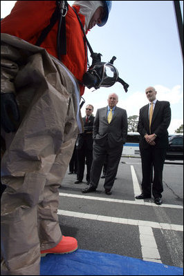 Vice President Dick Cheney and Department of Homeland Security Secretary Michael Chertoff watch a demonstration of an emergency worker donning protective gear during a visit to the Federal Law Enforcement Training Center in Glynco, Georgia, May 2, 2005.