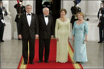 President George W. Bush, Laura Bush, Vice President Dick Cheney and Lynne Cheney stand with Australian Prime Minister John Howard and his wife Mrs. Janette Howard in the Blue Room for a photograph during the official dinner Tuesday, May 16, 2006.