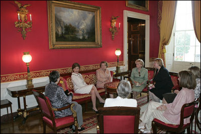 Mrs. Laura Bush hosts a tea for Mrs. Janette Howard, wife of Australian Prime Minister John Howard, in the Red Room Tuesday, May 16, 2006.