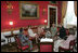 Mrs. Laura Bush hosts a tea for Mrs. Janette Howard, wife of Australian Prime Minister John Howard, in the Red Room Tuesday, May 16, 2006.