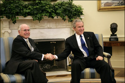 President George W. Bush and Prime Minister John Howard of Australia meet the press in the Oval Office Tuesday, May 16, 2006.
