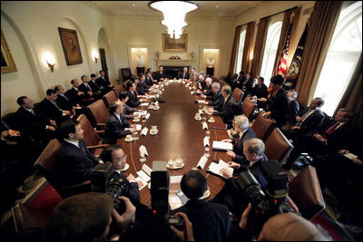 President George W. Bush and members of his staff and Cabinet meet with Chinese President Hu Jintao in the Cabinet Room Thursday, April 20, 2006.