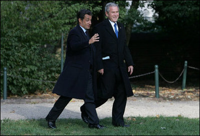 President George W. Bush and President Nicolas Sarkozy share a moment as they walk to a joint press availability Wednesday, Nov. 7, 2007, at Mount Vernon. The tour of the Virginia home of George Washington coincided with a series of meetings by the two leaders during the visit by the French leader to the United States.