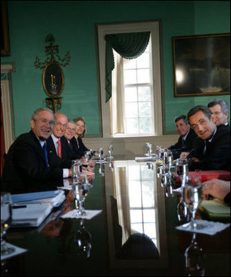President George W. Bush and President Nicolas Sarkozy of France pause for cameras as they meet in the Large Dining Room at the Mount Vernon Estate in Mount Vernon, Va., Wednesday, Nov. 7, 2007.