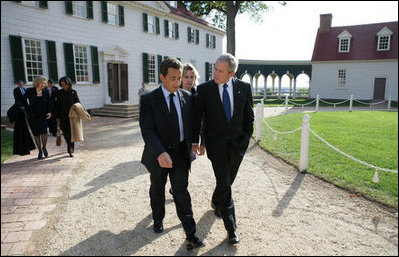 President George W. Bush and President Nicolas Sarkozy of France walk a path from George Washington's mansion during their tour Wednesday, Nov. 7, 2007, of the first president's home.
