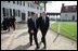 President George W. Bush and President Nicolas Sarkozy of France walk a path from George Washington's mansion during their tour Wednesday, Nov. 7, 2007, of the first president's home.