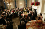 President George W. Bush addresses guests during the official dinner for India's Prime Minister Dr. Manmohan Singh, in the State Dining Room, Monday evening, July 18, 2005, at the White House. White House photo by Eric Draper