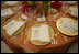 The table setting for President Bush is seen prior to the start of the official dinner, Monday, July 18, 2005 at the White House, in honor of the visit by India's Prime Minister Dr. Manmohan Singh. White House photo by Eric Draper