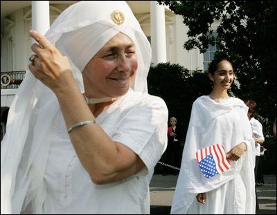 Guests attending the official arrival of India's Prime Minister Dr. Manmohan Singh, are seen Monday, July 18, 2005, on the South Lawn of the White House. 