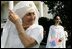 Guests attending the official arrival of India's Prime Minister Dr. Manmohan Singh, are seen Monday, July 18, 2005, on the South Lawn of the White House. 