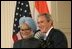 President George W. Bush and India's Prime Minister Dr. Manmohan Singh, appear before reporters during a joint news conference, Monday, July 18, 2005, in the East Room of the White House. 