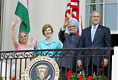 President Bush stands with India's Prime Minister Dr. Manmohan Singh, Laura Bush and Singh's wife, Mrs. Gursharan Kaur, Monday, July 18, 2005 during the Prime Minister's official visit to the White House. 