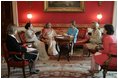 Laura Bush and Mrs. Gursharan Kaur, wife of India's Prime Minister Dr. Manmohan Singh, meet for coffee Monday, July 18, 2005, during an official visit to the White House. 
